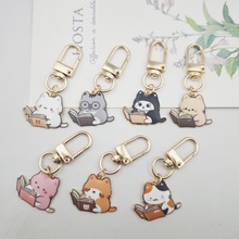 跨境新款可爱看书猫吊坠钥匙扣包包挂件U盘耳机挂件女士钥匙扣