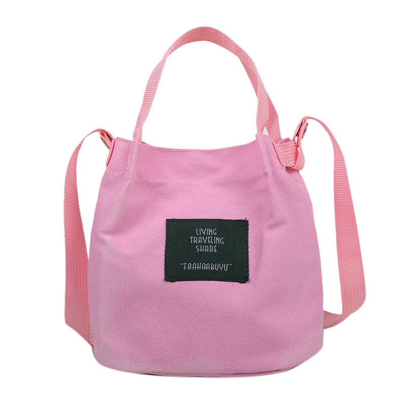 Bolso de mujer nuevo estilo coreano simple bolso de lienzo de chicas fresco de color sólido bolso de cubo de moda moda bolsa de mochila casual