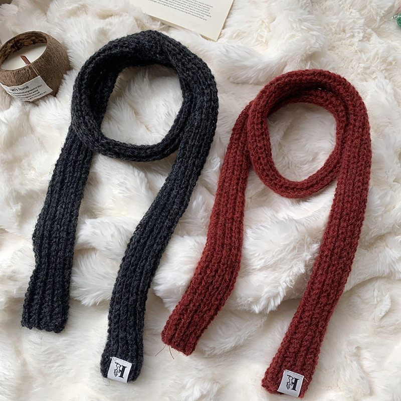 Otoño y invierno bufandas mujeres 2025 nuevo color sólido caliente de protección de cuello de lana de punto largo bufandas al por mayor