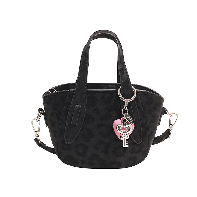 Retro nicho leopardo bolso de cubo de mujer otoño invierno 2025 nuevo tipo de bolso de cestas de verduras de mano bolsa de hombro casual mochila moda