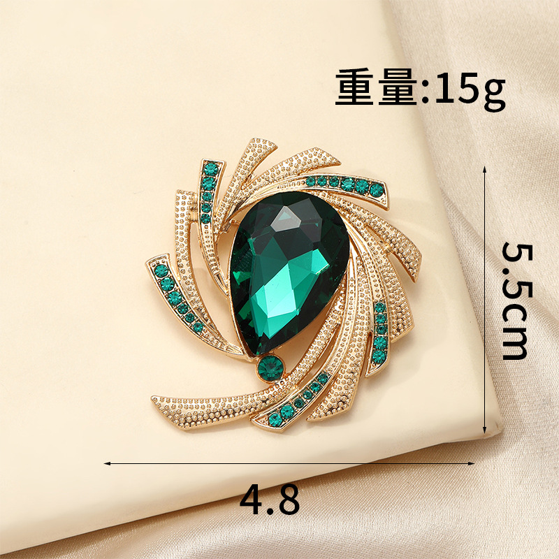 Broche de luxe rotative en cristal vert épingle anti-dévoilement_voghion.com