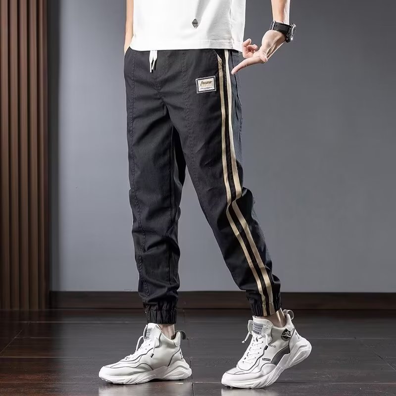 Pantalones de herramientas para hombres, modelos de primavera y otoño, moda de marca de moda, otoño delgado, pies sueltos, pantalones vaqueros de talla grande en forma de cono Harlan para hombres