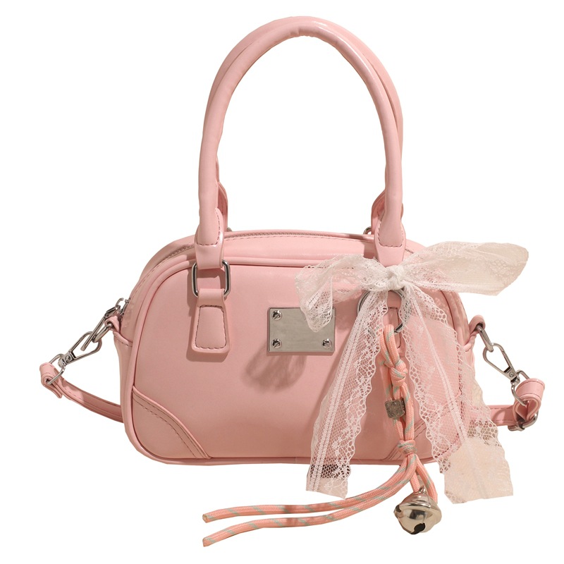 Bolsa de bolos portátil coreana de nicho para mujeres 2026 nueva textura mochila de hombro de estilo extranjero para viajar simple
