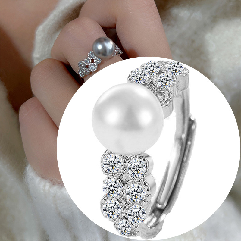 Adjustable ring with stone from pearl with zircon