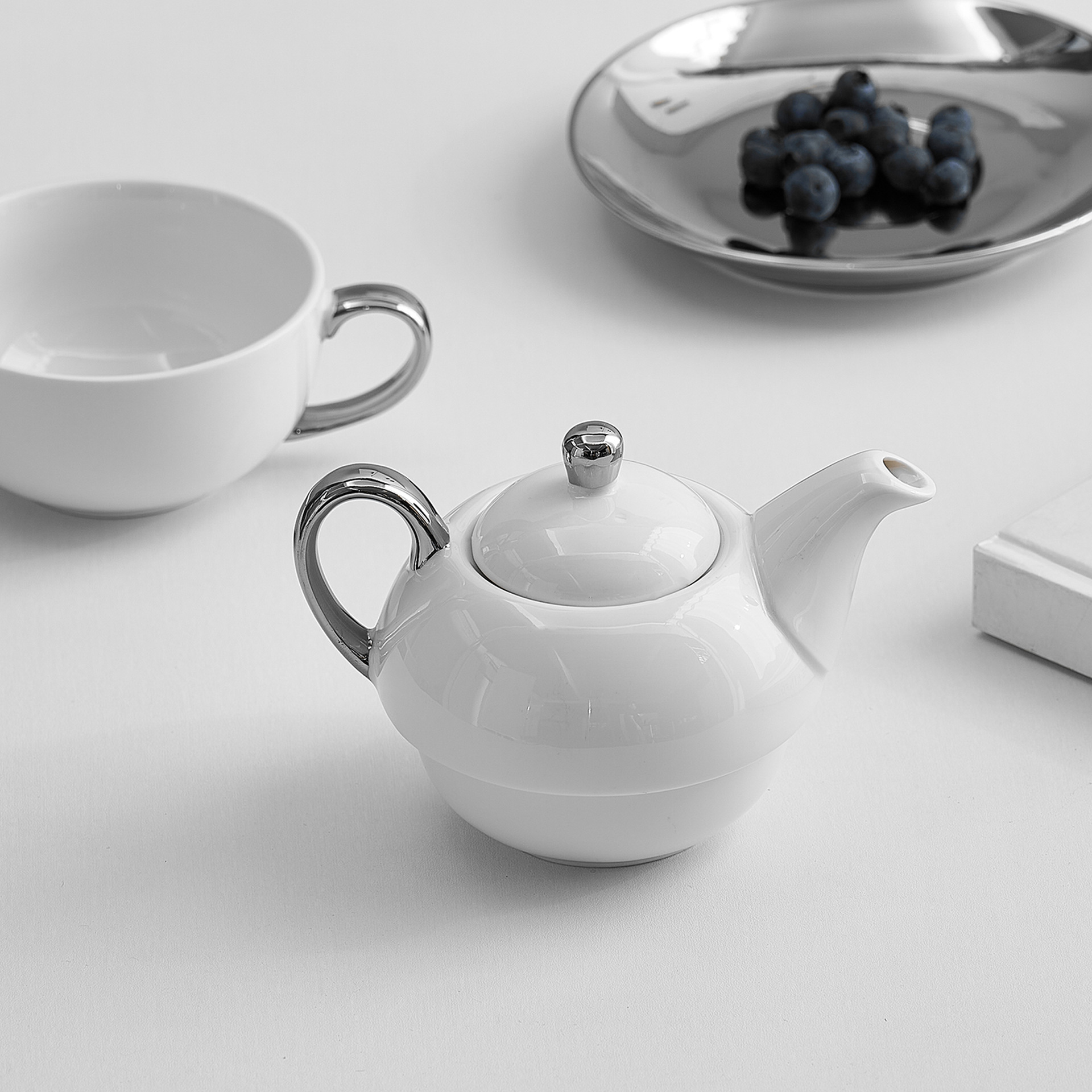 Tetera transfronteriza con logotipo, juego de té de cerámica, té de la tarde, taza de café, tetera, olla de lujo ligera