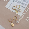 Fashionable asymmetrical earrings from pearl, silver 925 sample