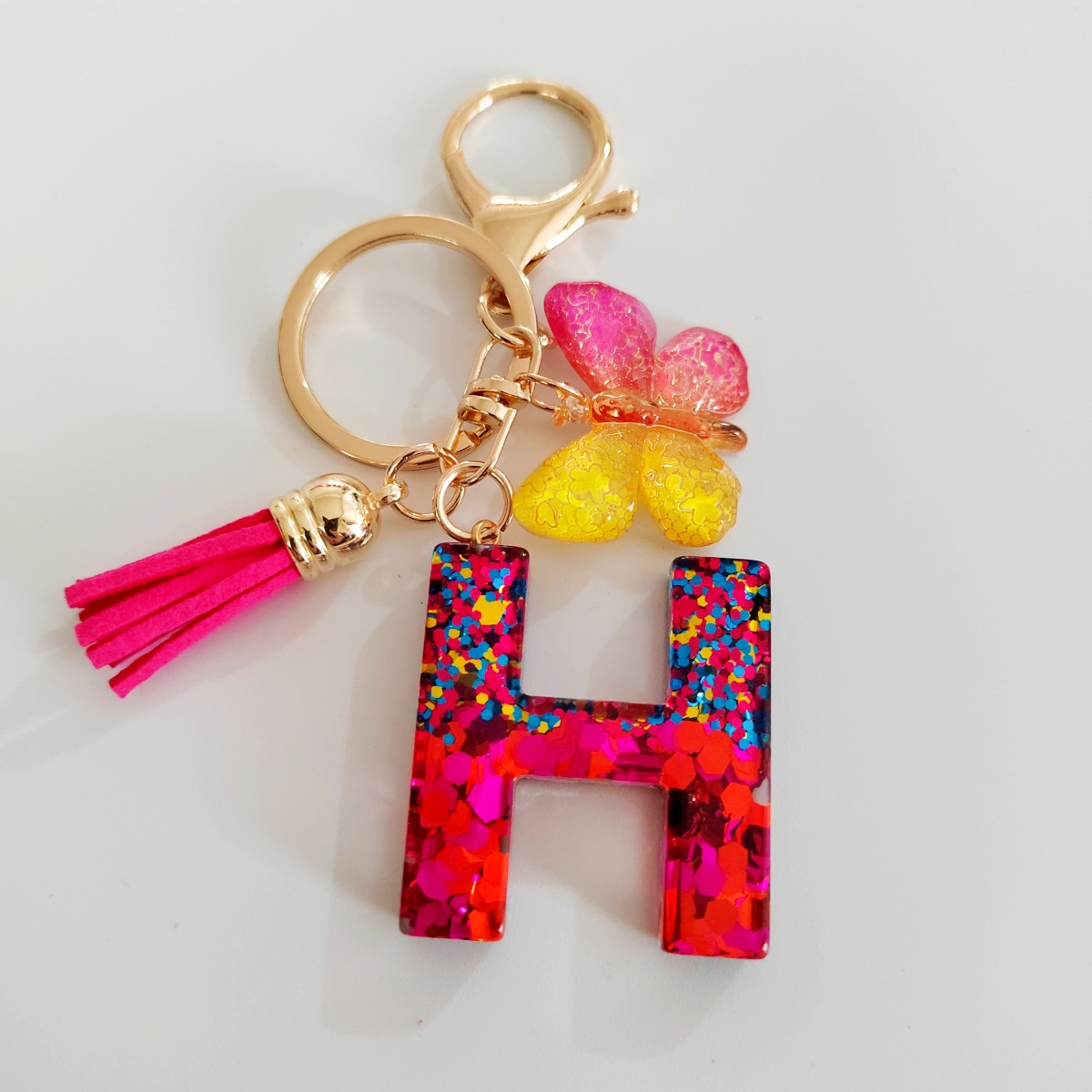 Ventas transfronterizas calientes de letras inglesas de color mixto colgante de llavero colgante de mariposa fringe de resina de llavero colgante de joyería