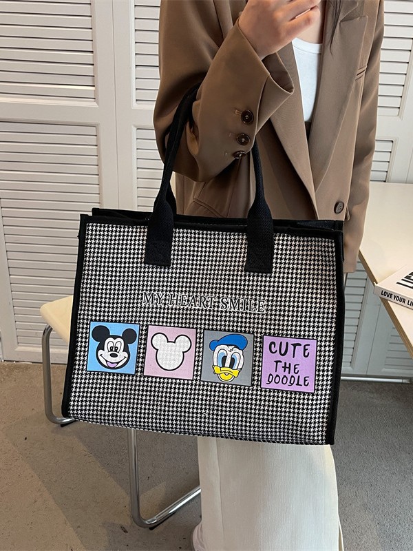 Bolso de mujer de alta sensación 2025 nuevo lienzo simple impresión de gran capacidad bolso de mano bolso de hombro de caricatura mamá