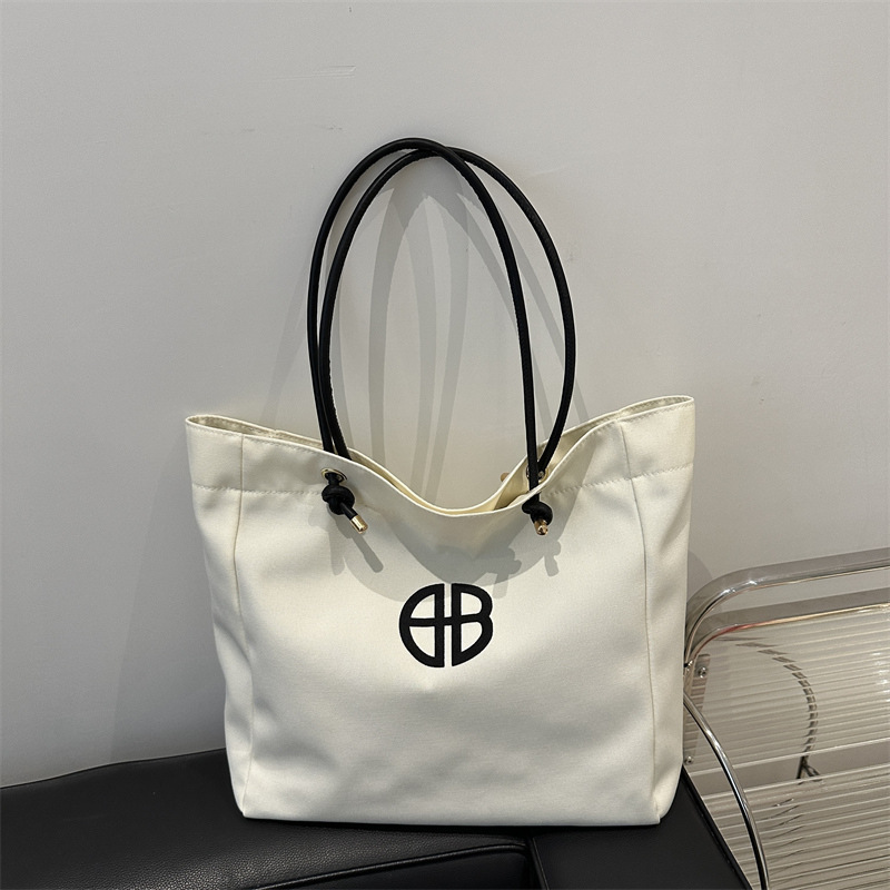 Bolsa de lienzo de gran capacidad de letras para mujeres este año nueva bolsa de hombro de moda universal bolsa de viaje bolsa de mano bolsa de mamá