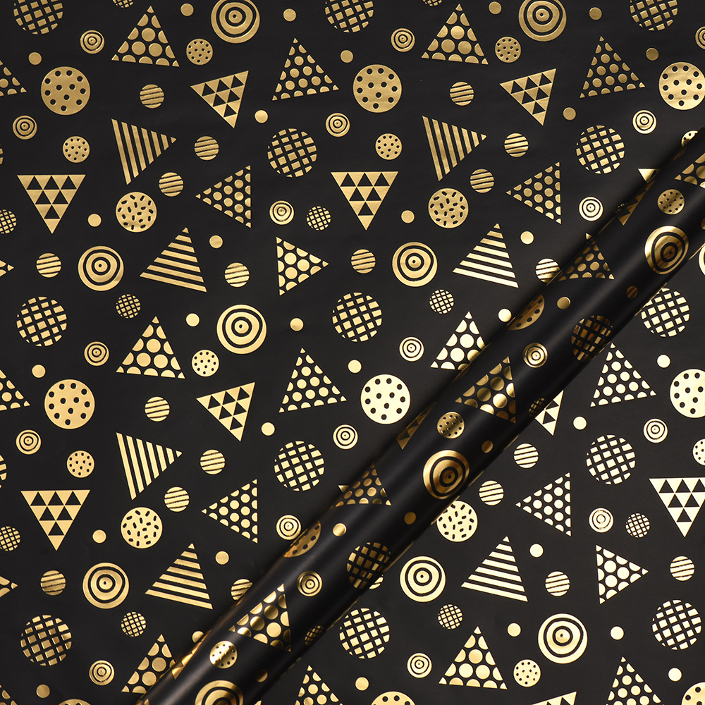 Nuevo papel de embalaje de caja de regalo grueso fondo negro estampado dorado estrella puntos rayas de papel de embalaje de regalo roll