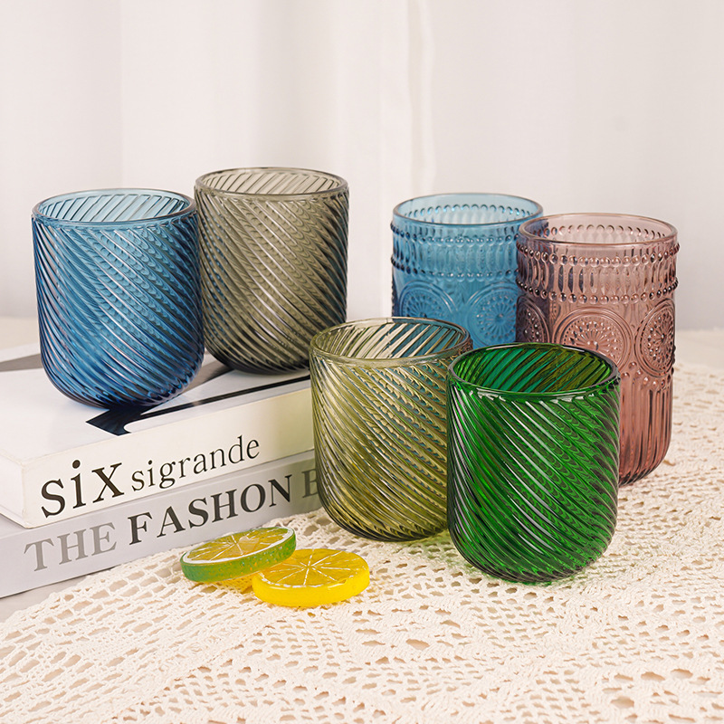Fábrica al por mayor tazas de agua europeas tazas de vidrio de colores tazas de enjuague bucal de hotel tazas de jugo en relieve tazas de leche domésticas gruesas