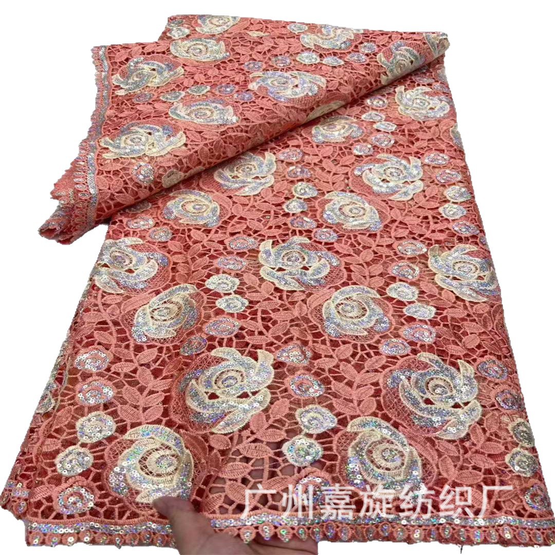 Tela de encaje africana con bordado láser de rosas huecas soluble en agua, en stock, para vestidos de moda.