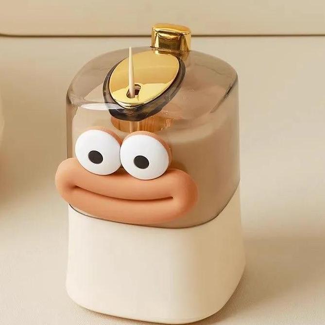 Caja de palillos de dientes doméstica de alto valor facial, caja de palillos de dientes de escritorio de la sala de estar de presión, creatividad de dibujos animados de palillos de dientes emergentes automáticamente