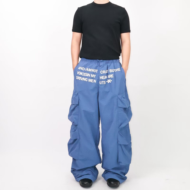 Blue multi-pocket paratrooper cargo pants, West Coast American style pants, high street vibe, elastic waist with drawstring, wide-leg pants