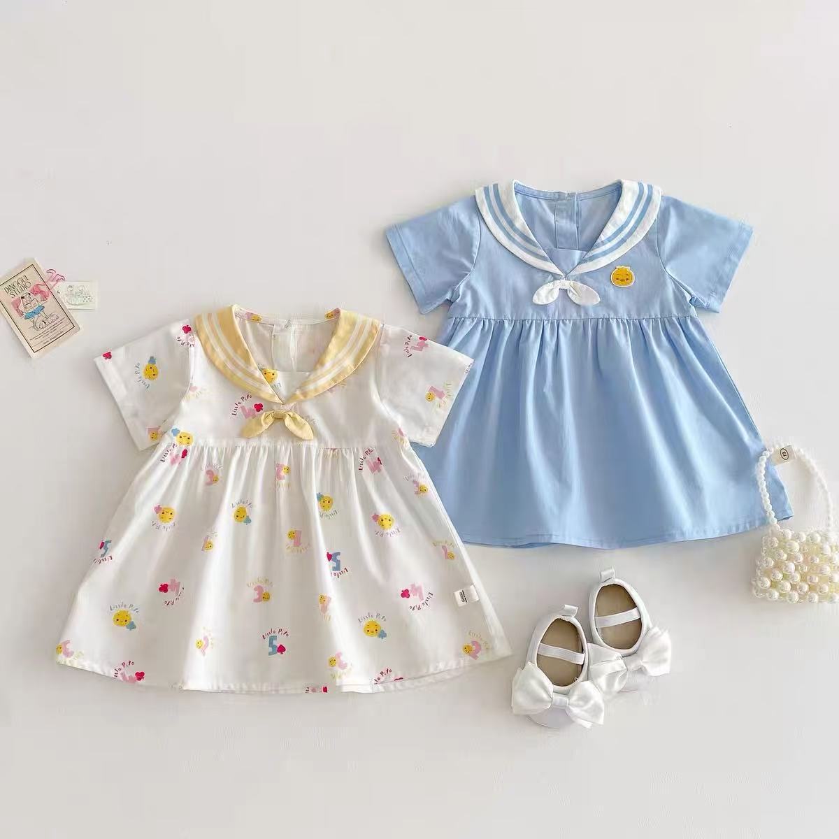 Vestido súper lindo para niñas nuevo verano bebé lindo vestido de manga corta de dibujos animados de verano azul marino