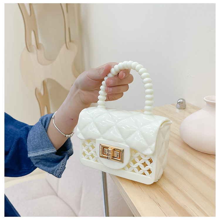 Fashion Solid Color Hollowed Children's Jelly Messenger Bag 12*9*5cm display picture 11