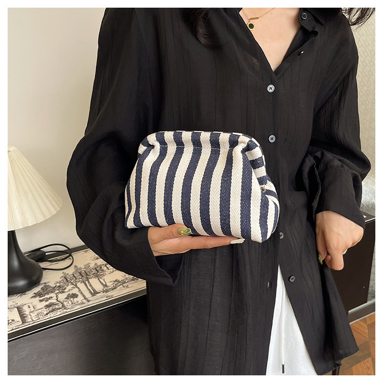 New cross-border fashion color-blocking striped cosmetic bag, women's loose change mobile phone storage bag, trendy and niche cloud clutch undefined