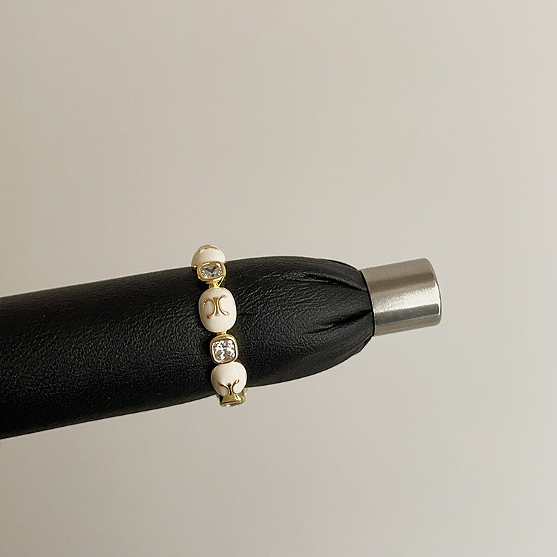 クリームクロスジルコンの指輪女子学生2025新型軽豪華高級感食指戒独特の美しい重ね指環