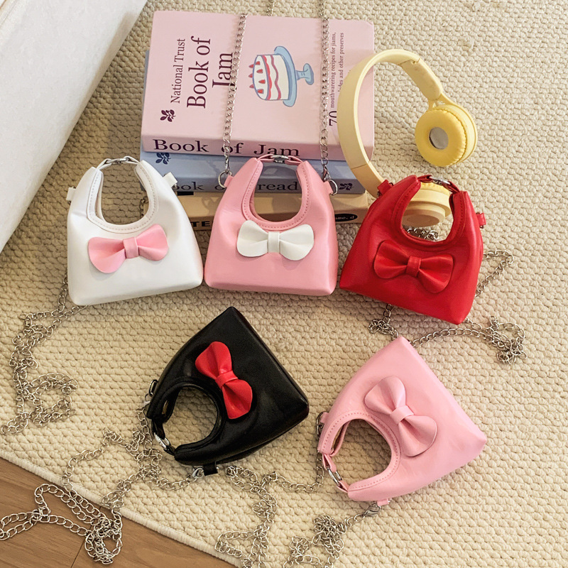 Dolce y lindo arco de hombro de niñas bolso de cadena mini pequeño bebé bolso de mano bolso de comercio exterior transfronterizo bolso de niños