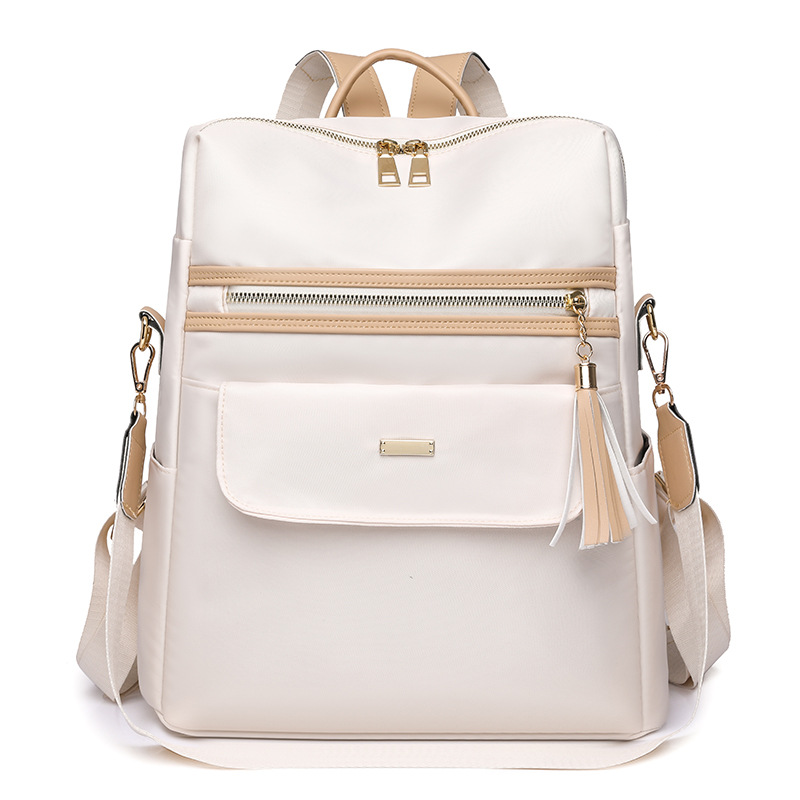 2023 nueva mochila de tela Oxford para mujer casual moda contraste color borla mochila de gran capacidad marea al por mayor