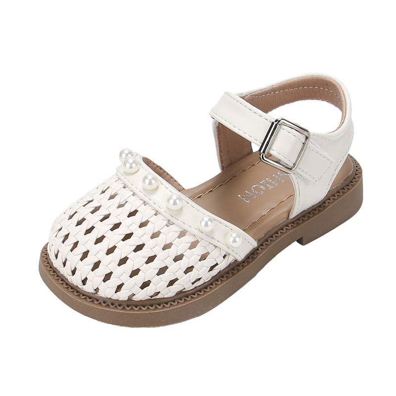 Niñas sandalias de moda versátiles 2026 verano nuevos niños huecos zapatos de princesa zapatillas de tejer para niños grandes