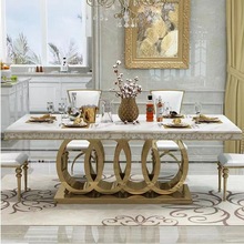 轻奢金色不锈钢岩板餐桌椅组合后现代时尚家用别墅大型大理石餐台