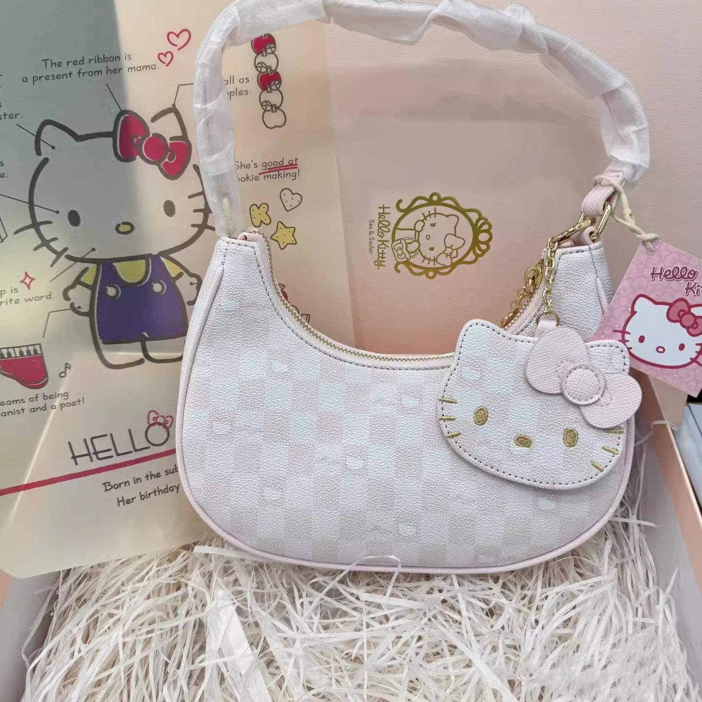 2025 nueva bolsa de polvo para las axilas de Kitty cuadros de tablero de ajedrez dulce adorable media luna bolso de hombro diseño de nicho