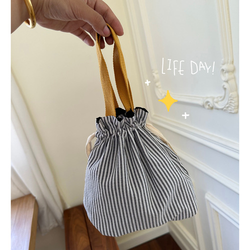 Cute drawstring storage bag, cuffed handbag, portable and cute water cup bag, fashionable outing sundries, women's makeup bag