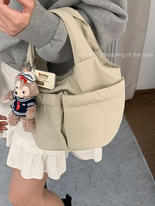 休闲简约手提包包女士包2025新款纯色尼龙布菜篮子包百搭水桶包|undefined