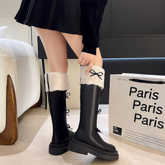 フランスの厚い底の甘い蝶結びの長靴2023の新型の秋冬の柔らかい妹の小さい背の復古のファッションの靴