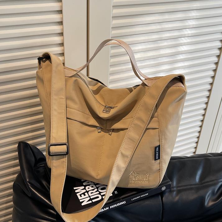 Bolso tote de lona de gran capacidad explosivo transfronterizo 2025 nuevo estilo de clase bolso de mensajero de ocio bolso de viaje femenino