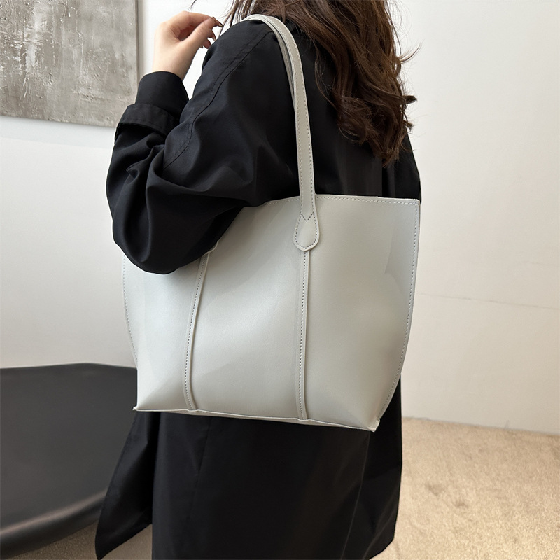 Bolsa coreana de gran capacidad de color sólido para mujeres 2024 nueva moda retro bolso de viaje simple bolso de hombro sólido
