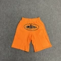 Orange shorts (printed in black)