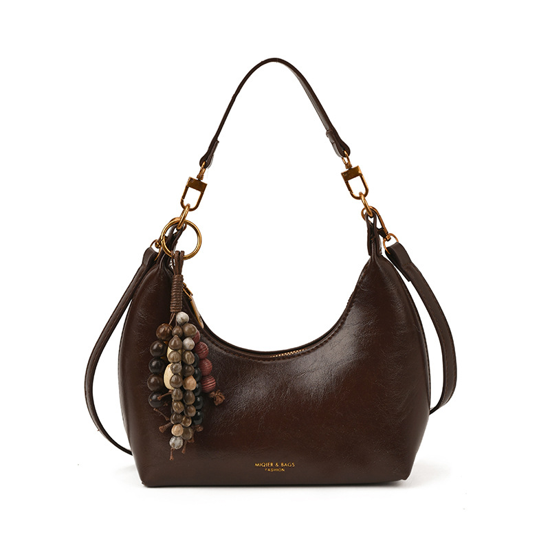 Nicho bolso de diseño de mujer 2025, nuevo otoño invierno retro ocio mochila de hombro, bolso de brazo portátil universal