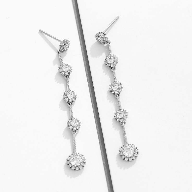 Xupin joyería aleación con incrustaciones pendientes de girasol temperamento femenino largo borla pendientes de hadas joyería al por mayor