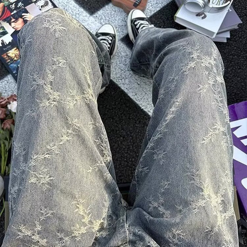 American-style high-street vibe camo tie-dye denim jeans for men: loose-fit, casual, washed-out look with dramatic ink-splashed, vintage-inspired drop-crotch design.