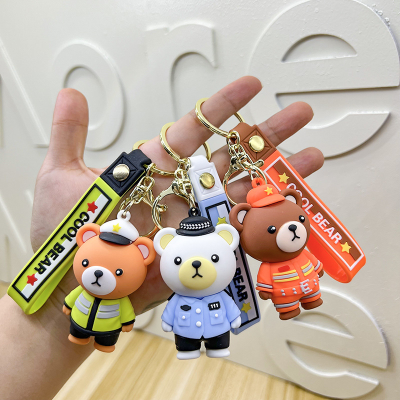 Cartoon traffic police bear key chain 3D three-dimensional police fire doll school bag car key pendant high-end gifts