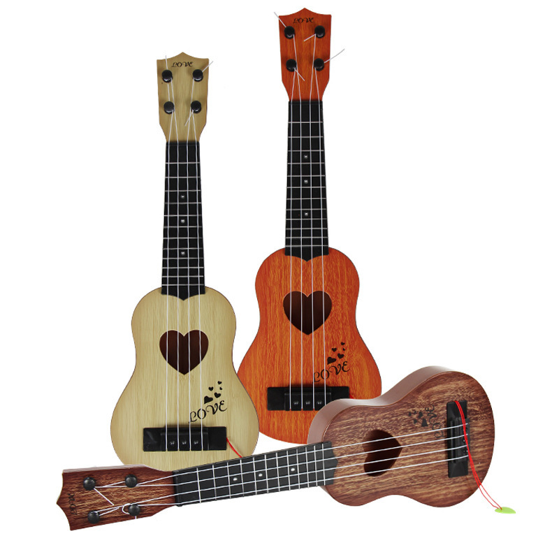 Dibujos animados ukelele guitarra pequeña niño púa instrumento musical juguete puede tocar música para principiantes juguete femenino
