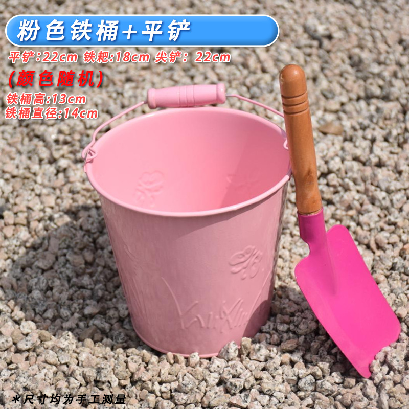 One pink iron bucket + one small flat shovel