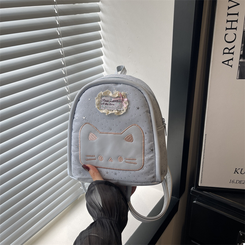 2026 nueva universidad estampada estrella mini mochila de estudiantes niña caricatura gato mochila pequeña