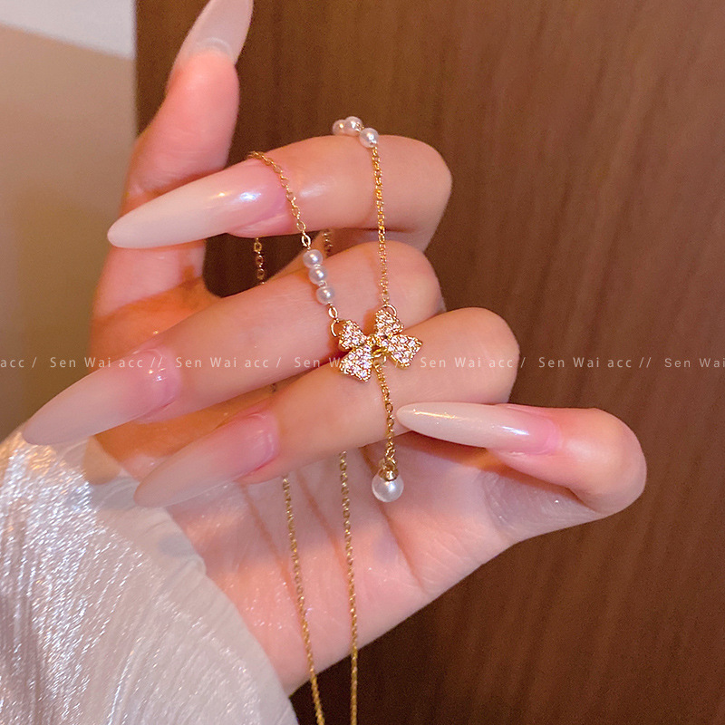 Korean-style ultra-shiny sweet pearl bow necklace for women, 2026 new model, exquisite light luxury clavicle chain accessory