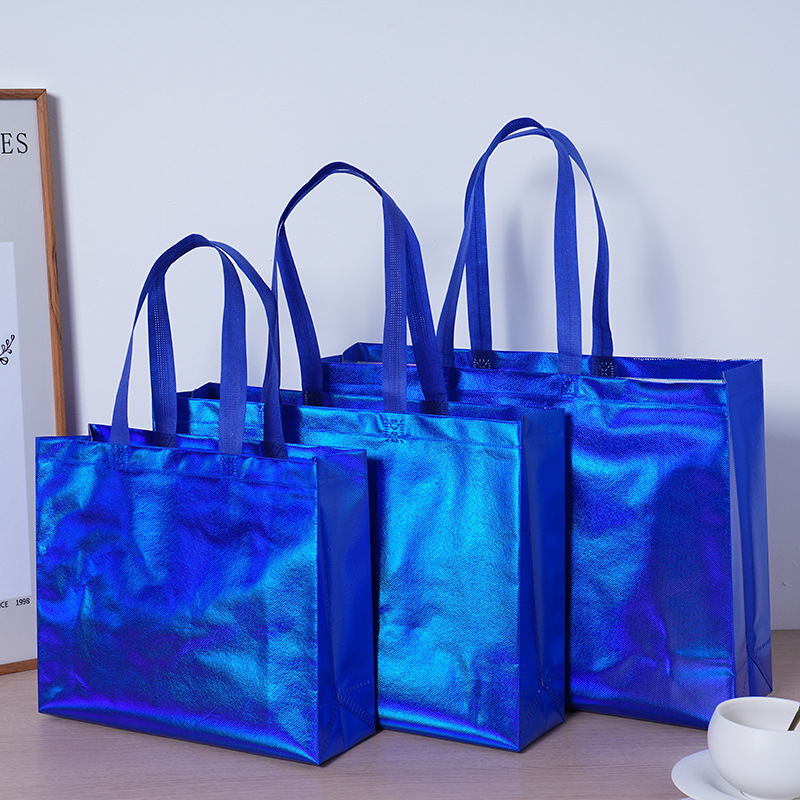 Bolsas de tela no tejida láser coloridas personalizadas logotipo de marca de moda bolsas de zapatos de mujer regalos de compras personalizados