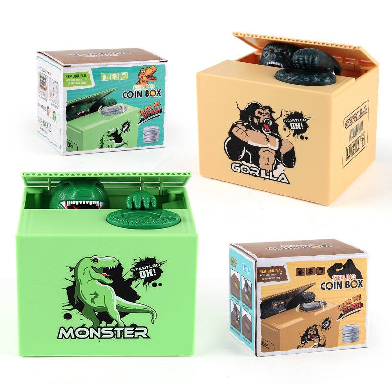 Juguetes de ocio para niños dibujos animados eléctricos robar dinero dinosaurio fruta caja moneda hucha comer dinero orangután hucha