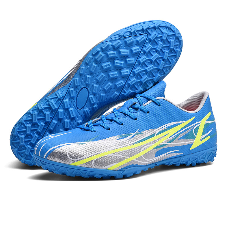 Zapatos de fútbol transfronterizos para niños juveniles juegos de entrenamiento físico entrenamiento de niños pequeños zapatos deportivos al por mayor