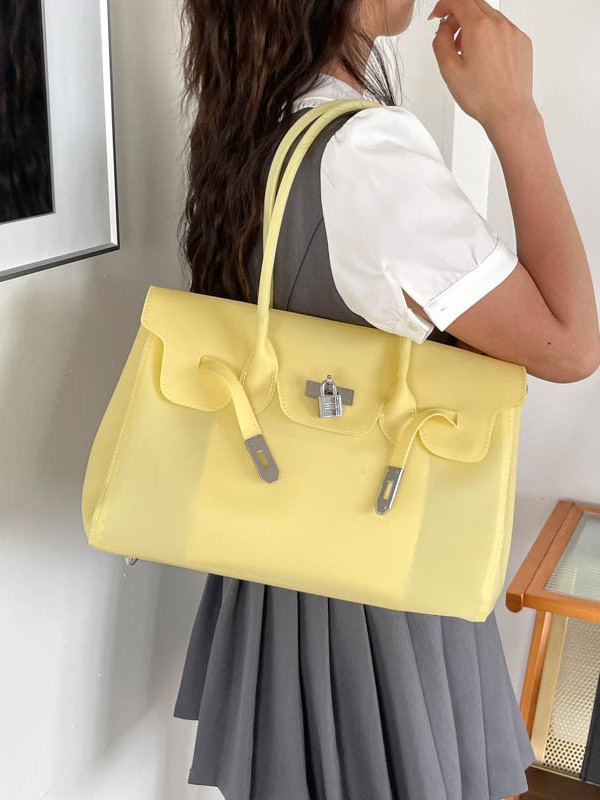 Bolsa de jalea portátil de platino bolso de mujer 2026 verano nuevo PVC color sólido gran capacidad versátil bolso de hombro