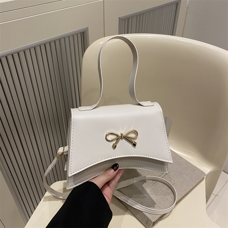 Nuevo diseño de nicho bowknot moda color sólido ins bandolera simple bandolera estilo occidental suave pequeño bolso cuadrado