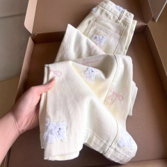 アメリカ式のかわいい熊の刺繍の蝶結びの広脚のジーパンの女性の夏の高腰の小さい大衆の百合の広脚のモップのズボン