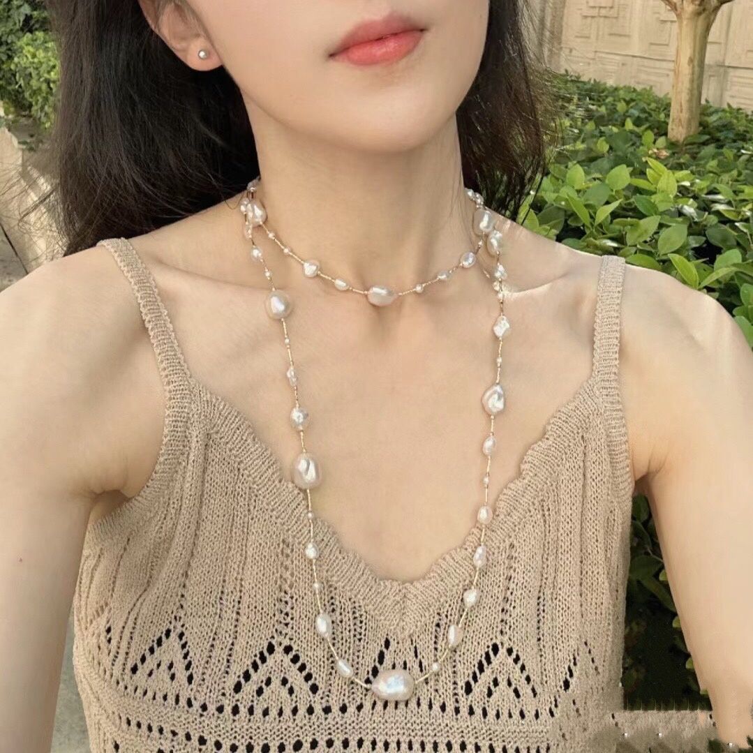 Barroco perla larga cadena de suéter cadena de collar cadena de clavícula un temperamento de uso múltiple 758 cuero artificial