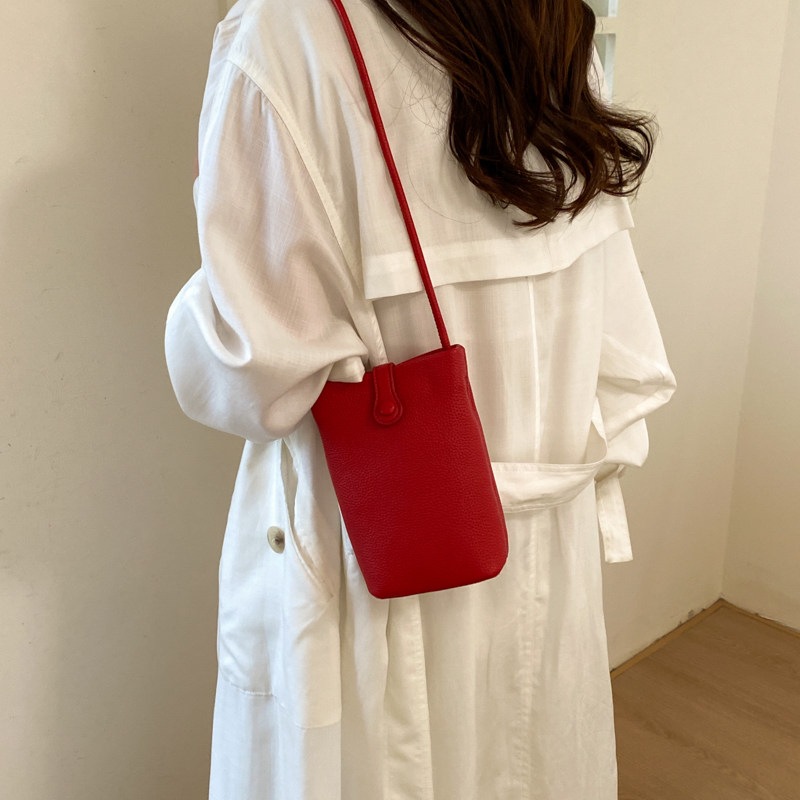 Nuevo mochila ligero verano 2026 teléfono móvil cuero suave versátil cubo de transporte mini mochila de hombro mujer estilo coreano