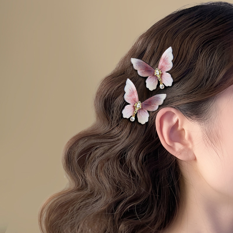 Horquilla de diamantes con incrustaciones de perlas de mariposa Clip de pico de pato lateral simple coreano de alta calidad, fresco y versátil, horquilla, accesorios para el cabello al por mayor